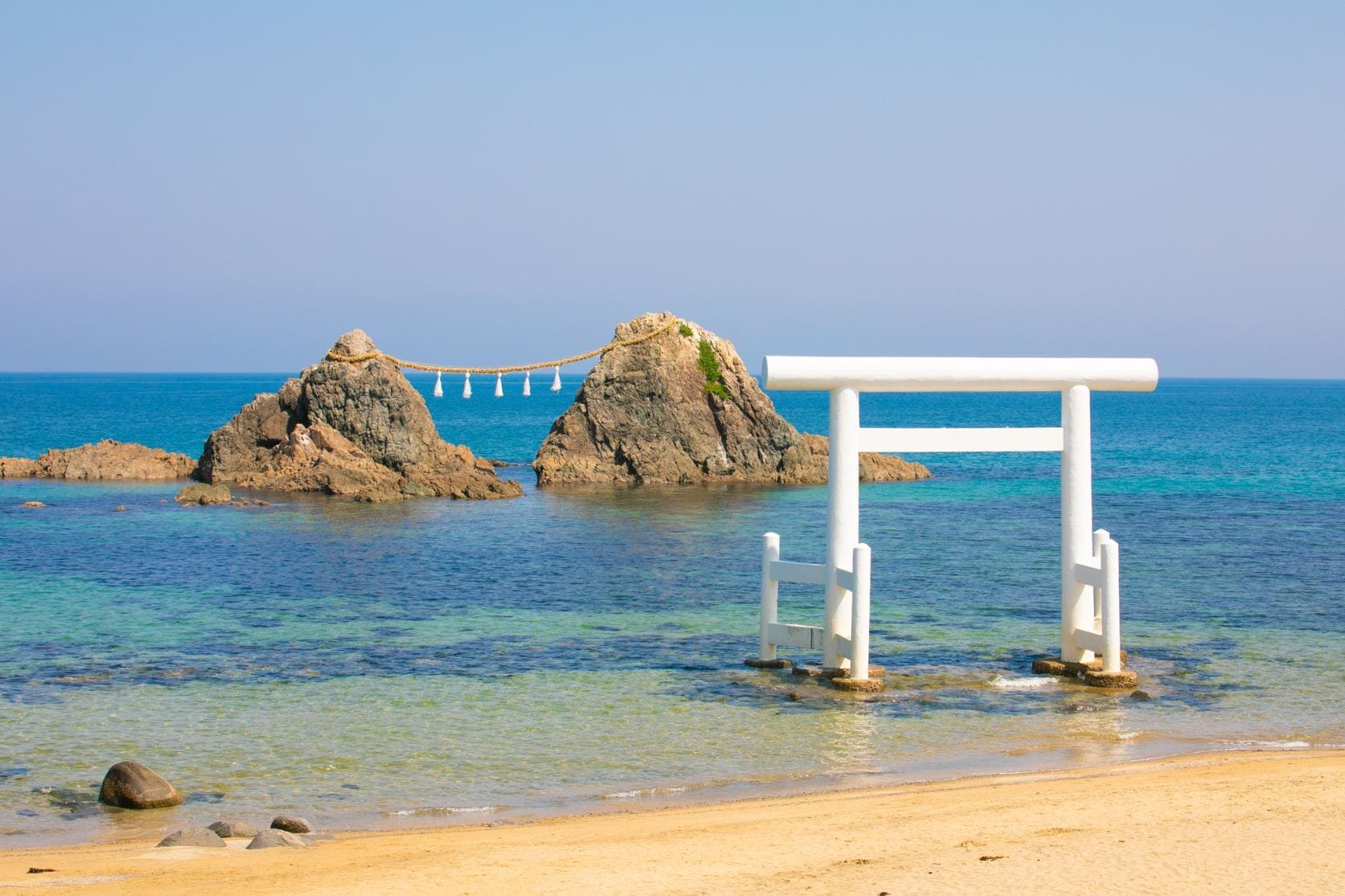 The iconic floating torii gate at Futamigaura with Meotoiwa couple rocks in the ocean